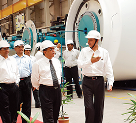 Tulsi Tanti walking the assembly unit with his team