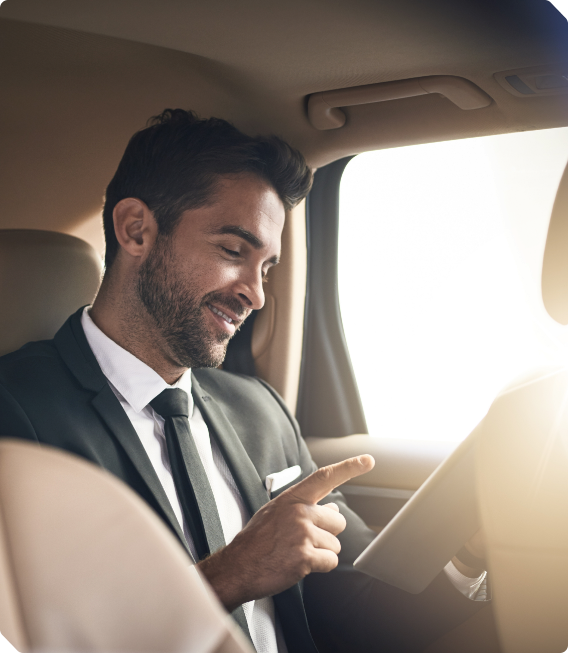 Businessman reviewing reports in a vehicle